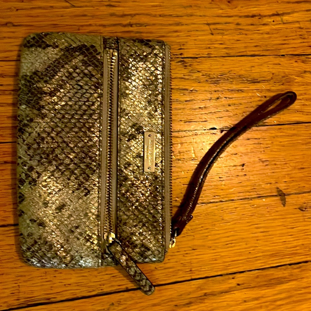 Kate Spade metallic gold wristlet zipper on top and in front